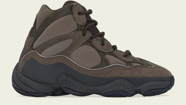 Side view of brown and black Yeezy boot.
